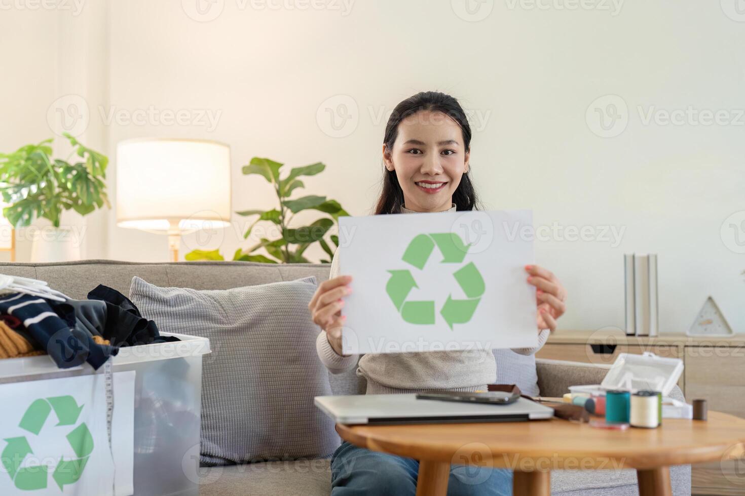 Woman Advocating Recycling with Clothing Bin. Sustainable Living and Eco Consciousness photo