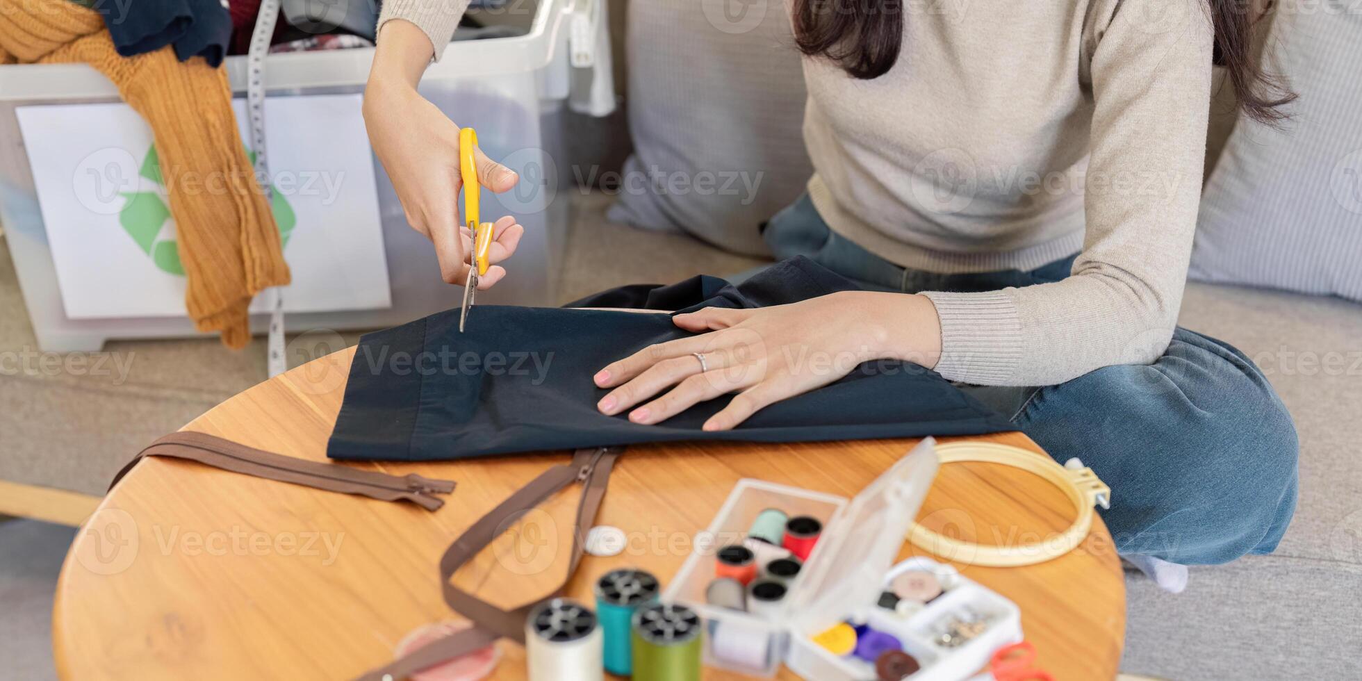 Woman Cutting Fabric for Sewing Project. DIY Craft and Design photo
