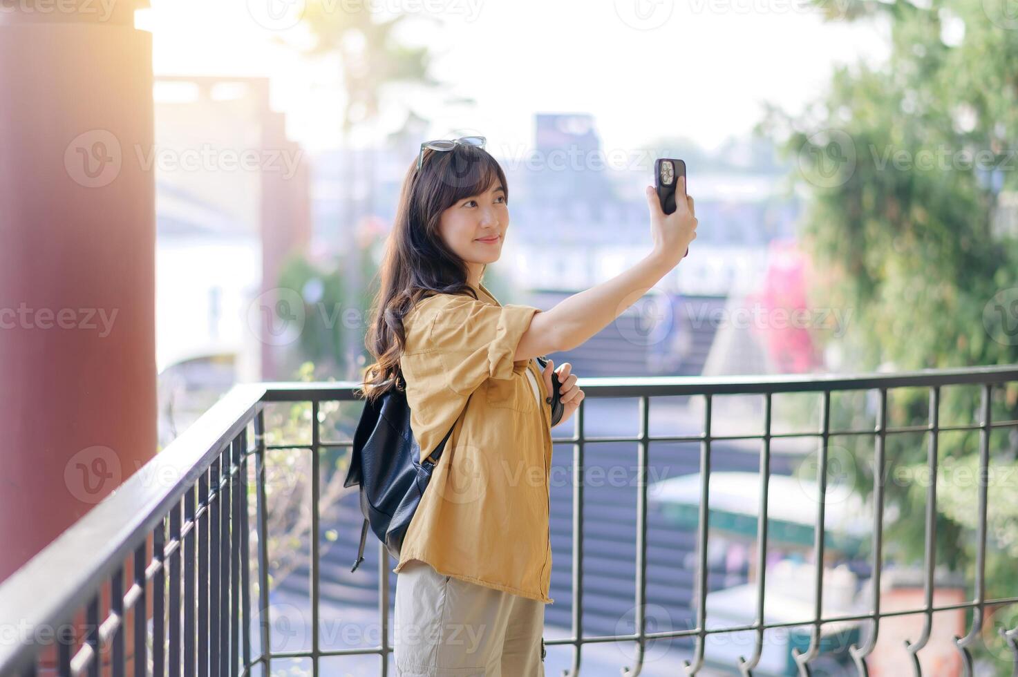 Traveler young asian woman in her 30s navigates Bangkok with her camera. Capture the world with confidence and share your unique story. photo