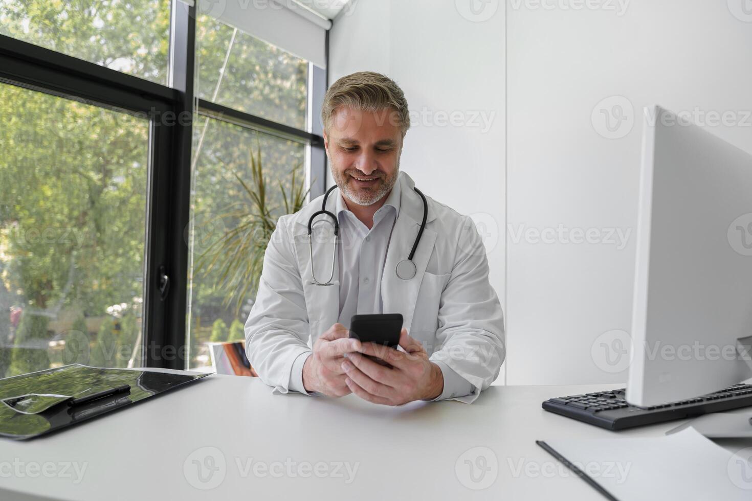 Professional doctor holding in hands phone and chatting with patient. Medicine online concept photo