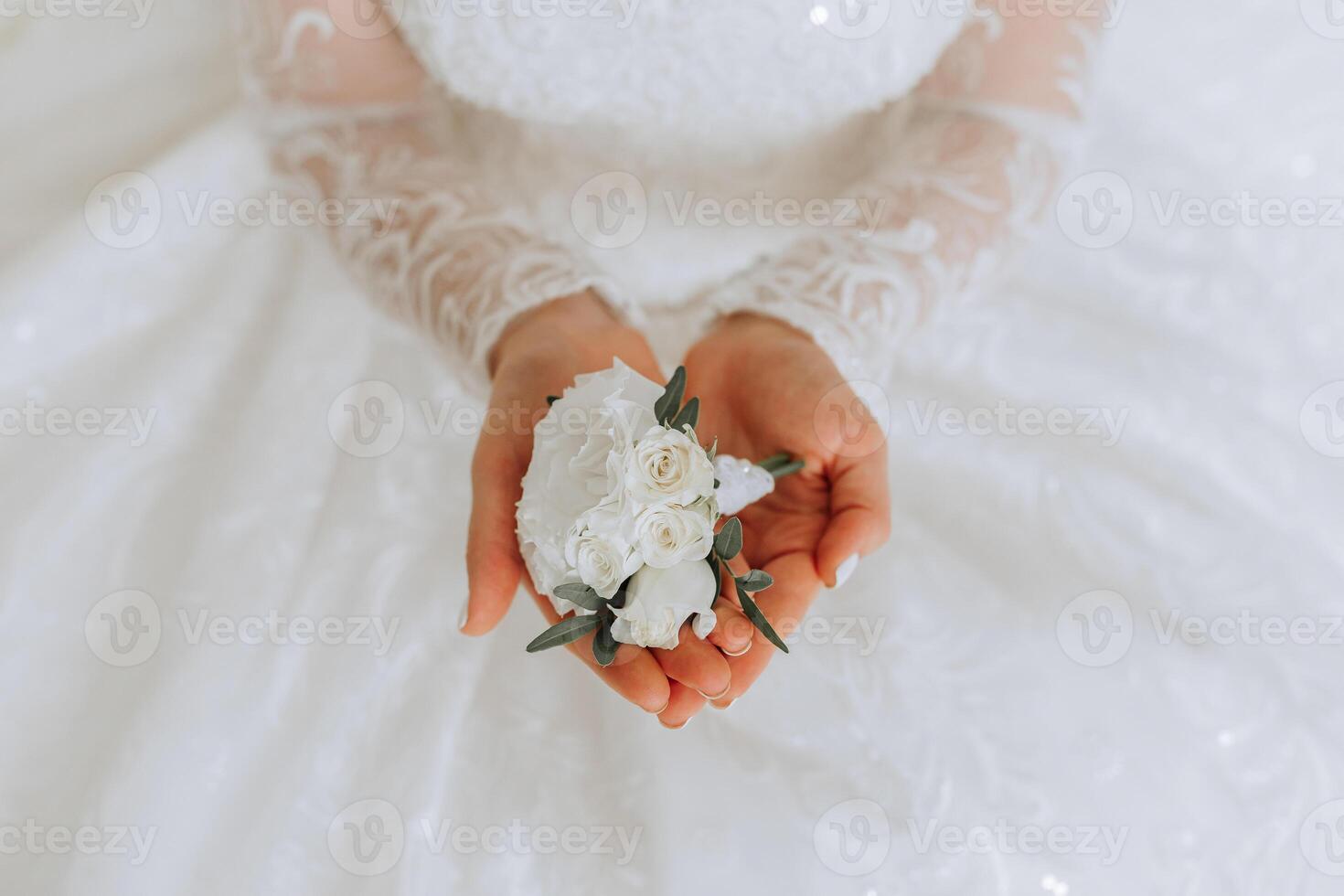 A woman is holding a white flower in her hand photo