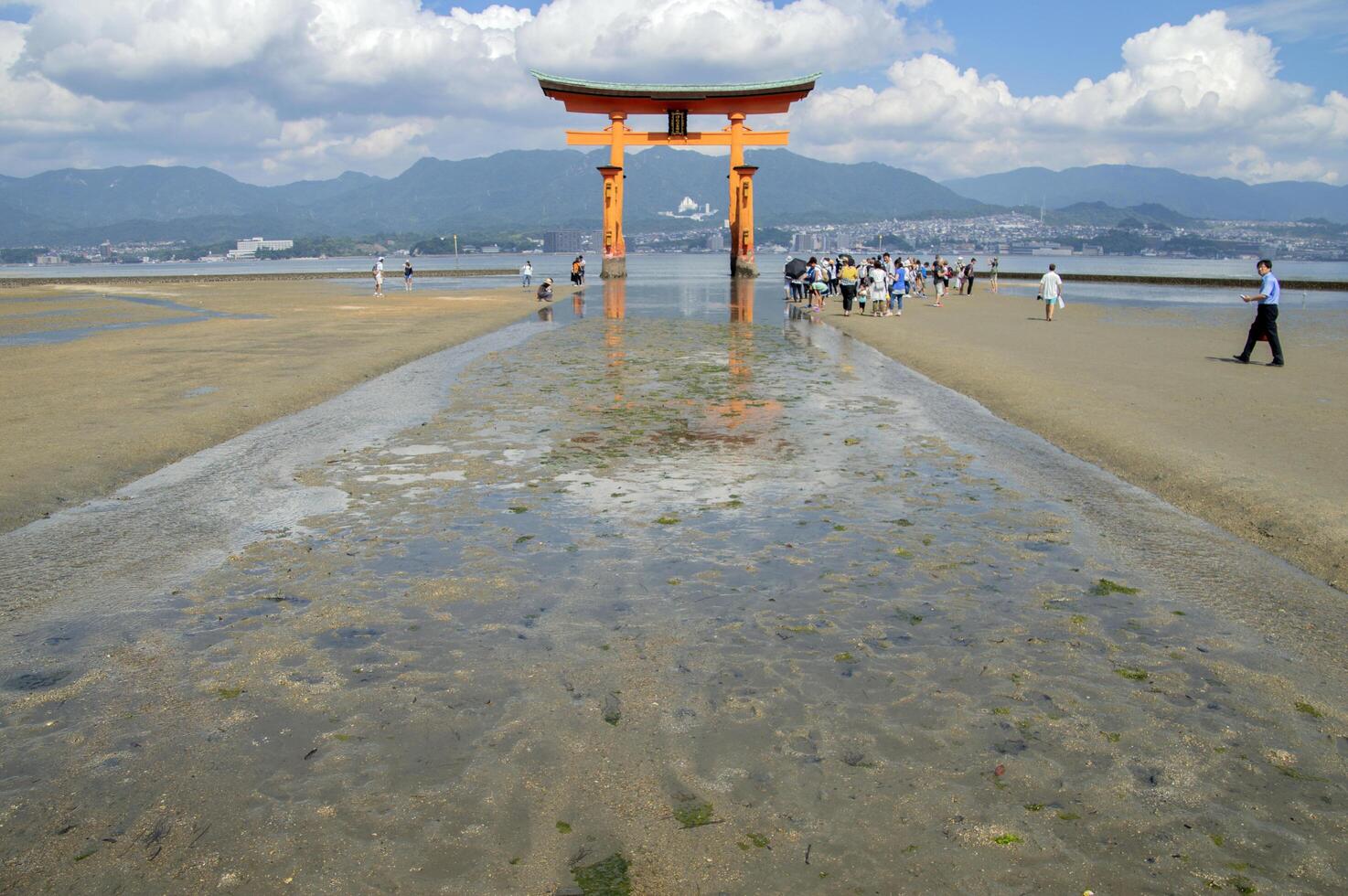 People At The Torii From The Itsukushima Shrine At Miyajima Japan 25-6-2016 photo