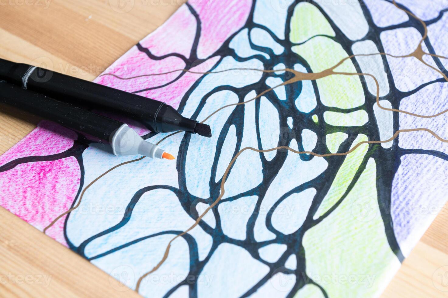 Artistic Creation with Markers on Paper - Vibrant Drawing Process photo
