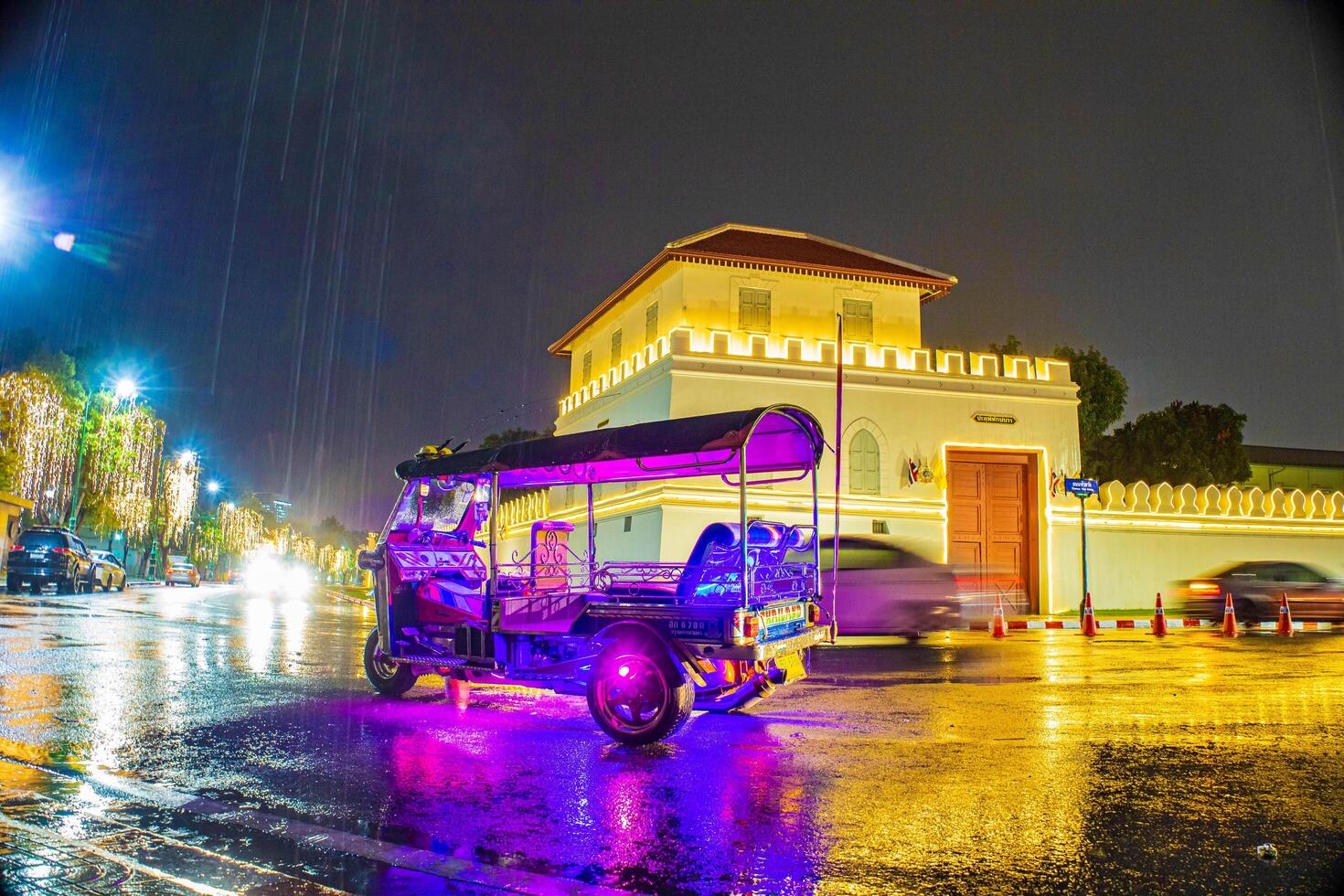 ITuk Tuk rides in front of the fortress amid the rain. photo