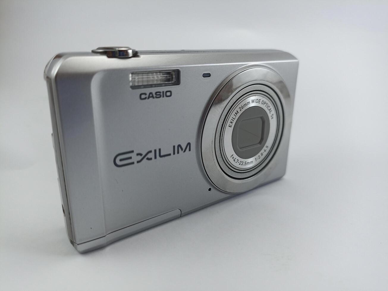 wonosobo central java indonesia august 7 2024 front view of old casio digital pocket camera isolated on white background, casio exilim, photography equipment photo