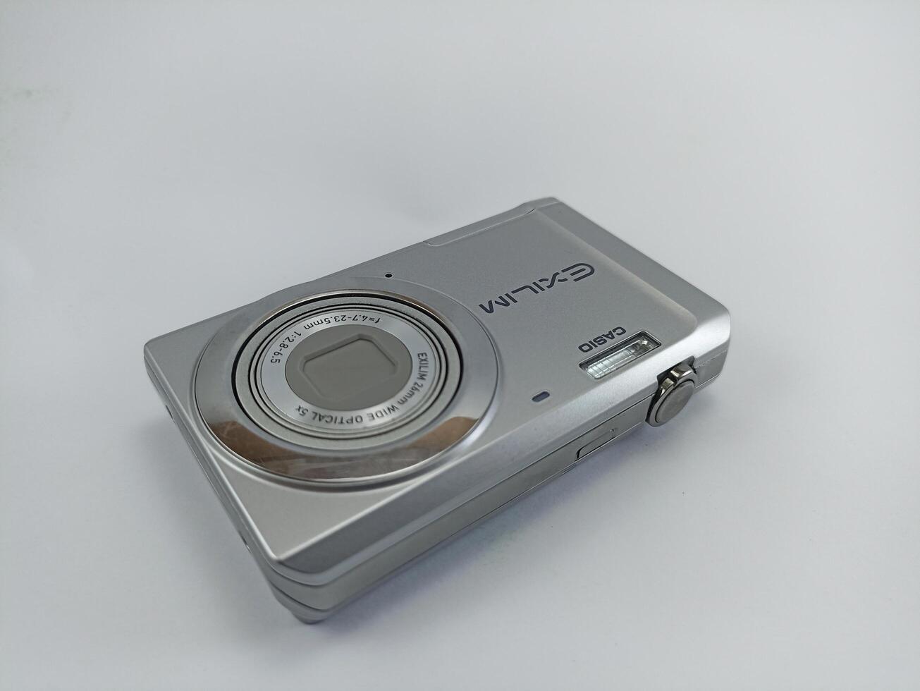 wonosobo central java indonesia august 7 2024 front view of old casio digital pocket camera isolated on white background, casio exilim, photography equipment photo