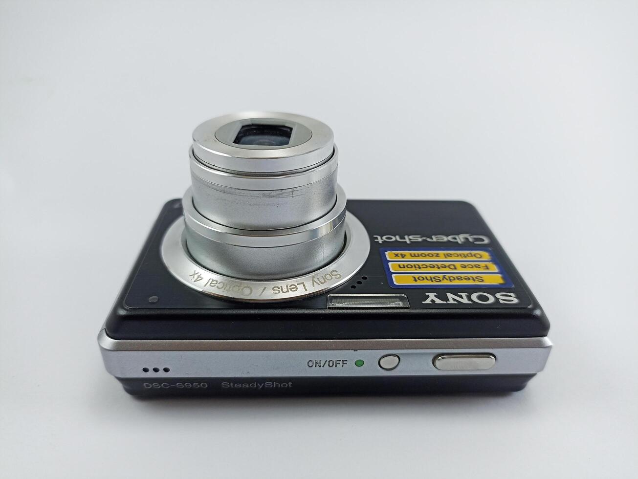 Wonosobo, Central Java, Indonesia August 7 2024 front view of an old Sony digital pocket camera isolated on a white background, Sony Cybershot, photography equipment photo