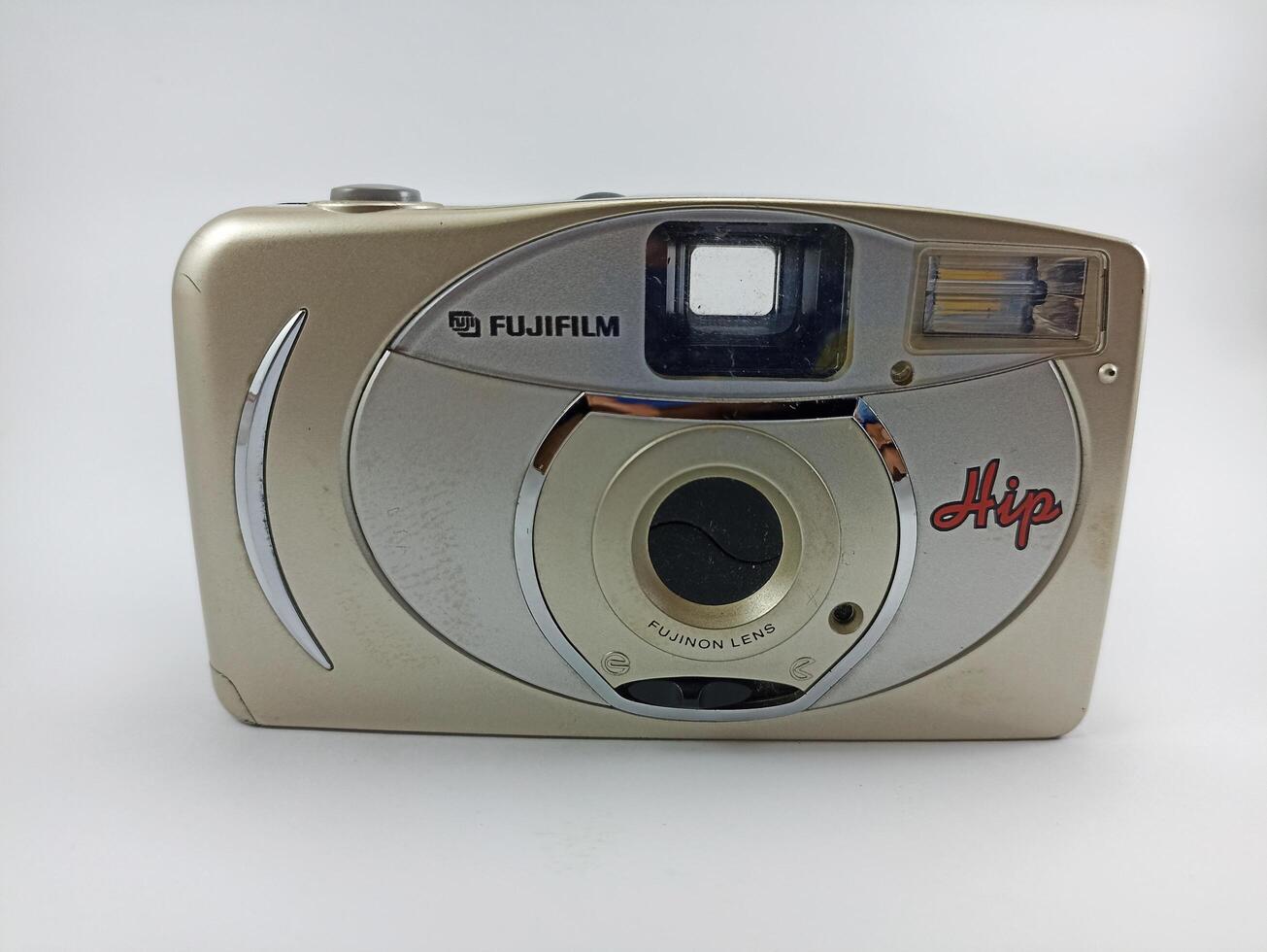 wonosobo central java indonesia august 7 2024 front view of fujifilm analog camera isolated on white background, antique camera photographic equipment photo