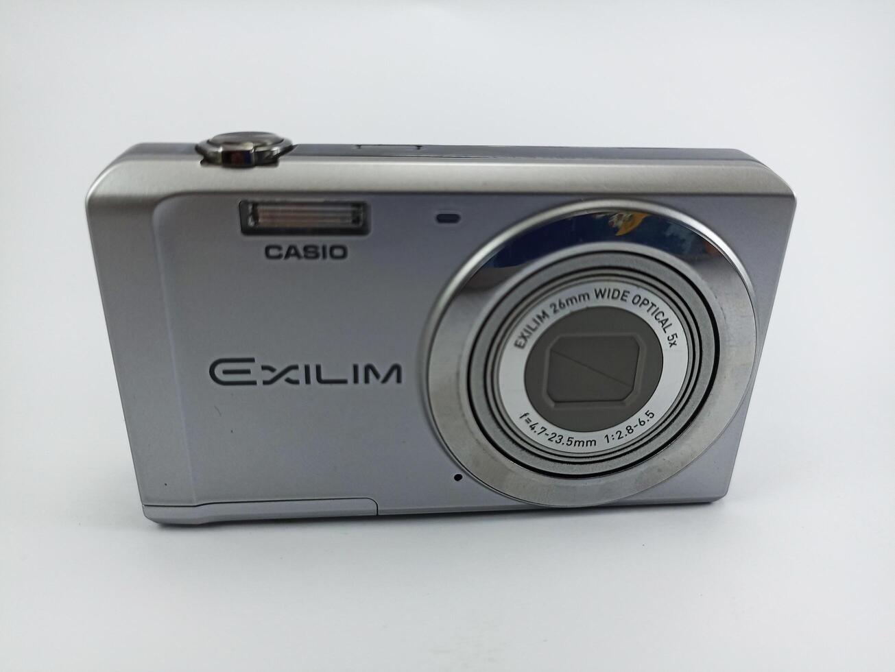 wonosobo central java indonesia august 7 2024 front view of old casio digital pocket camera isolated on white background, casio exilim, photography equipment photo