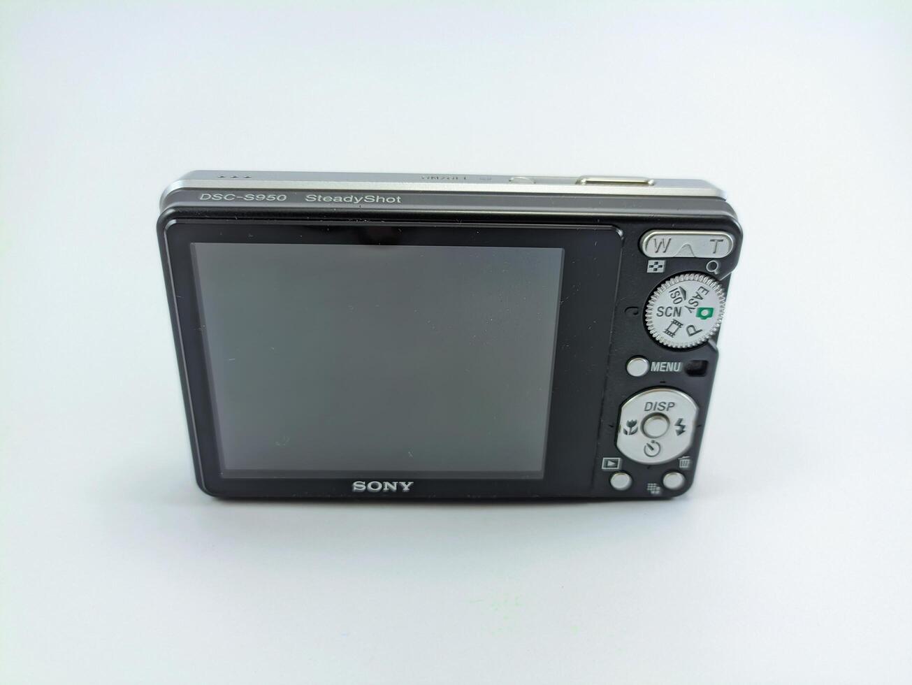 wonosobo central java indonesia august 7 2024 rear view of old sony digital pocket camera isolated on white background, sony cybershot, photography equipment photo
