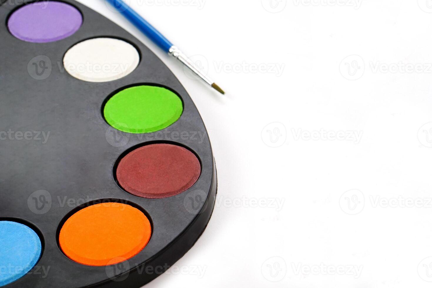Art palette with paint and blur brush on white background. Learning and paintings art concept. photo
