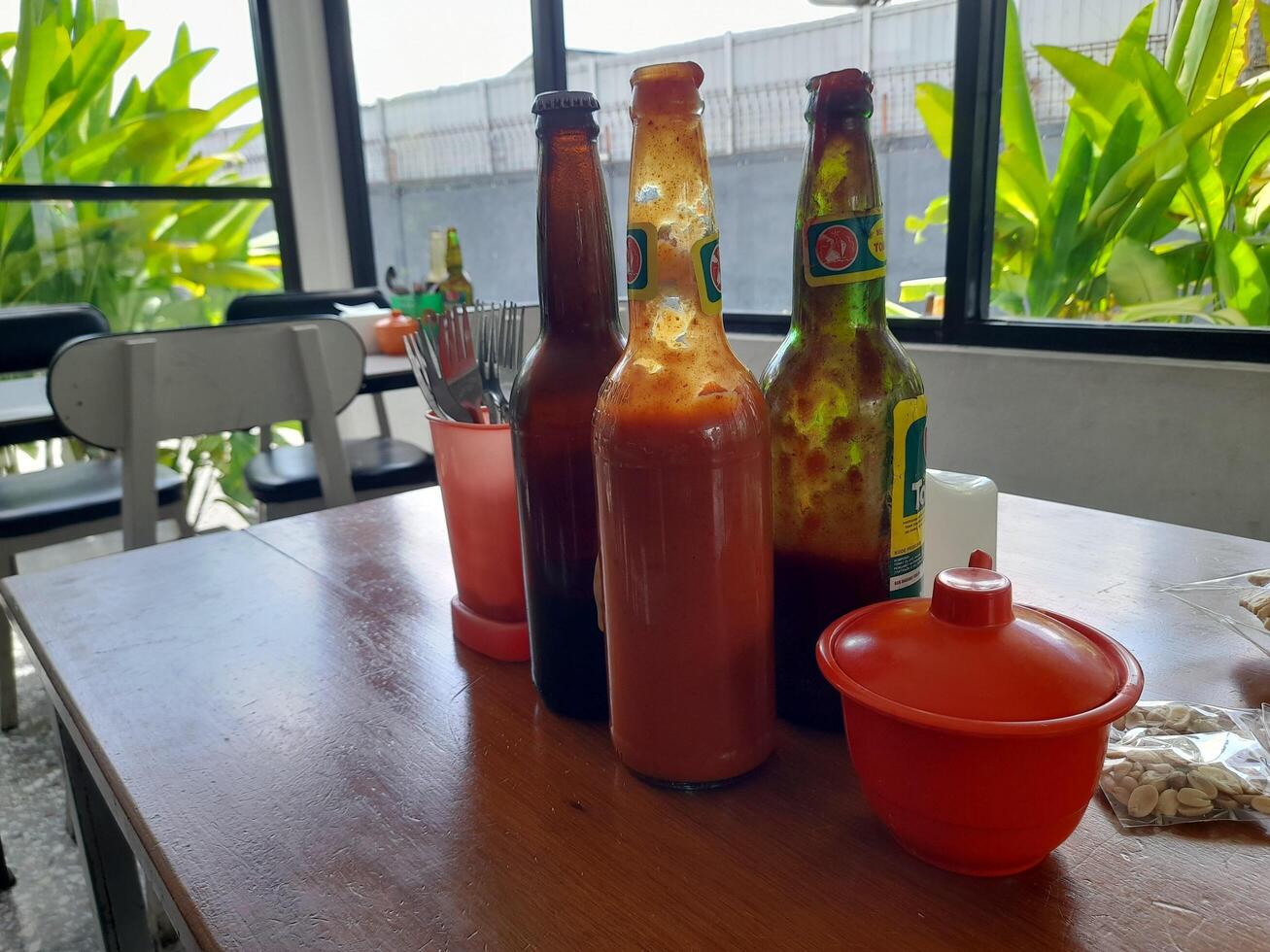 Mataram City, Indonesia - August 25, 2024. A table at a meatball restaurant in Mataram City on the island of Lombok. photo