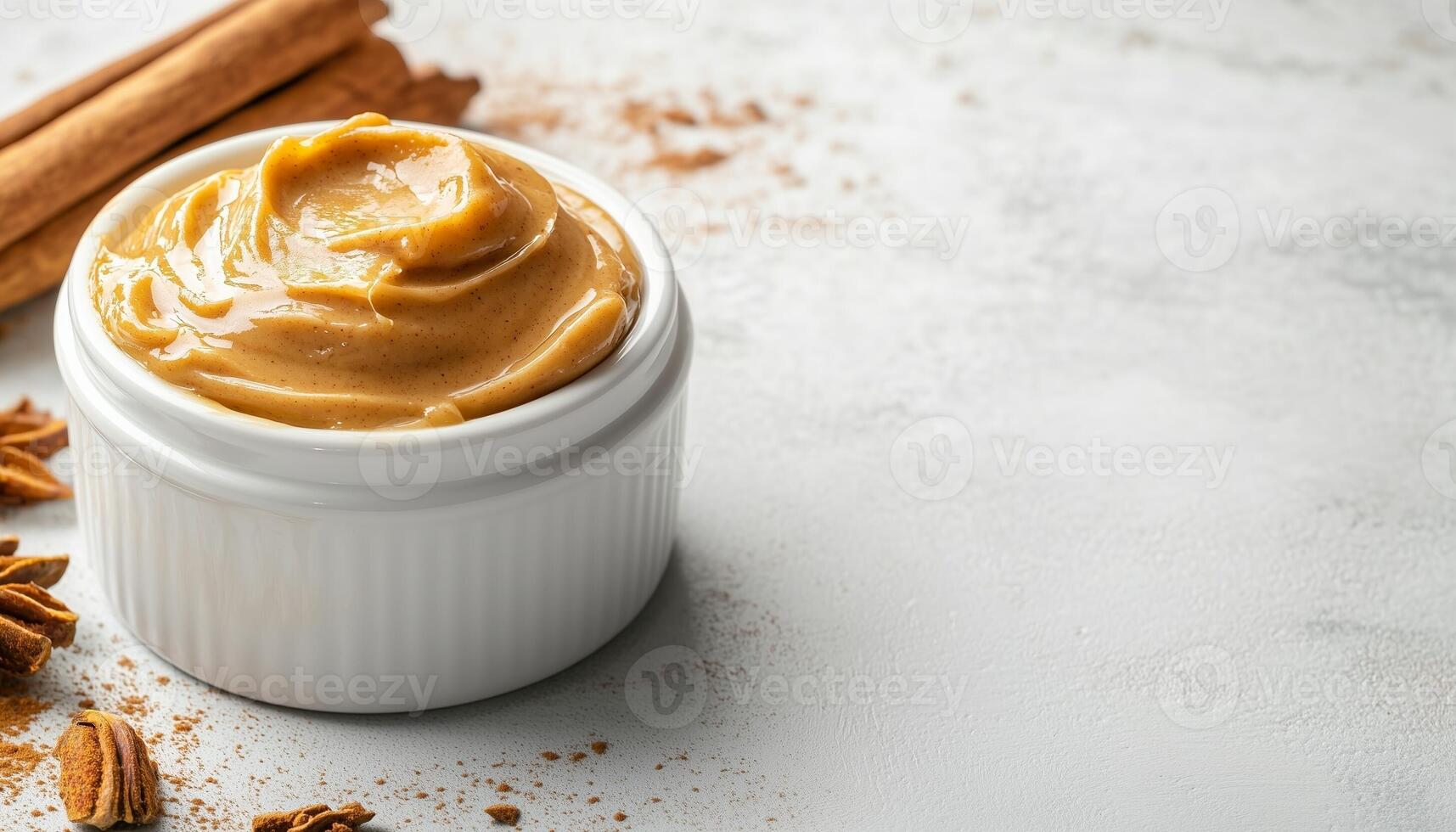 Cinnamon honey butter cream topping on white mug ceramic photo