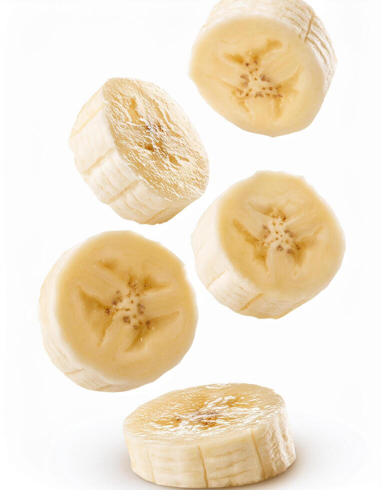 Falling banana slice isolated on white background, full depth of field. photo