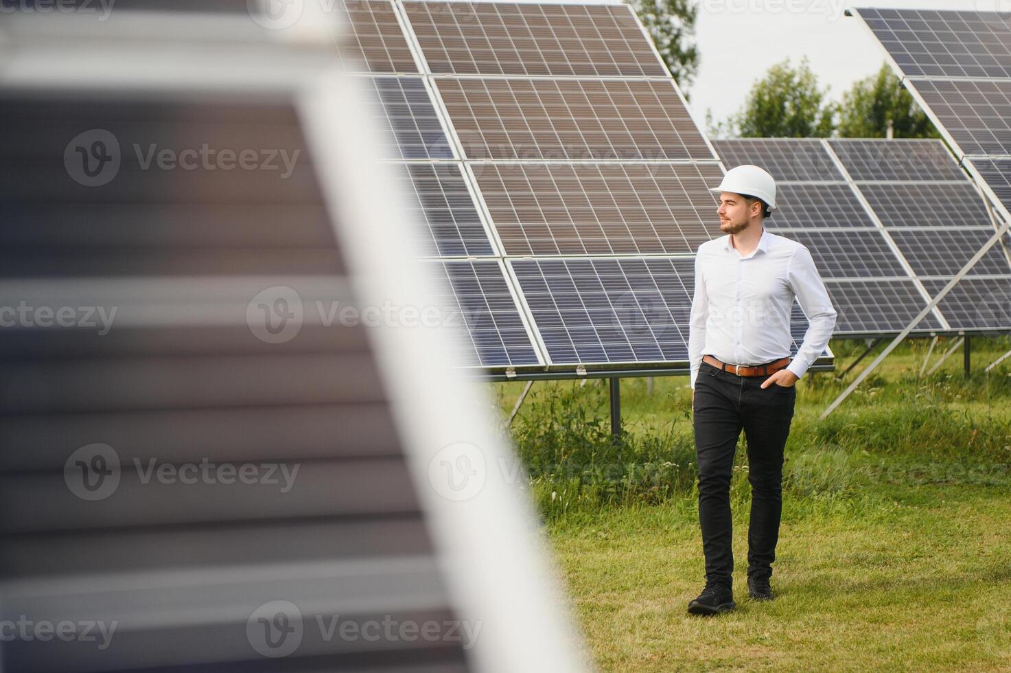 The solar farm, solar panel with engineer check the operation of the system, Alternative energy to conserve the worlds energy, Photovoltaic module idea for clean energy production. photo