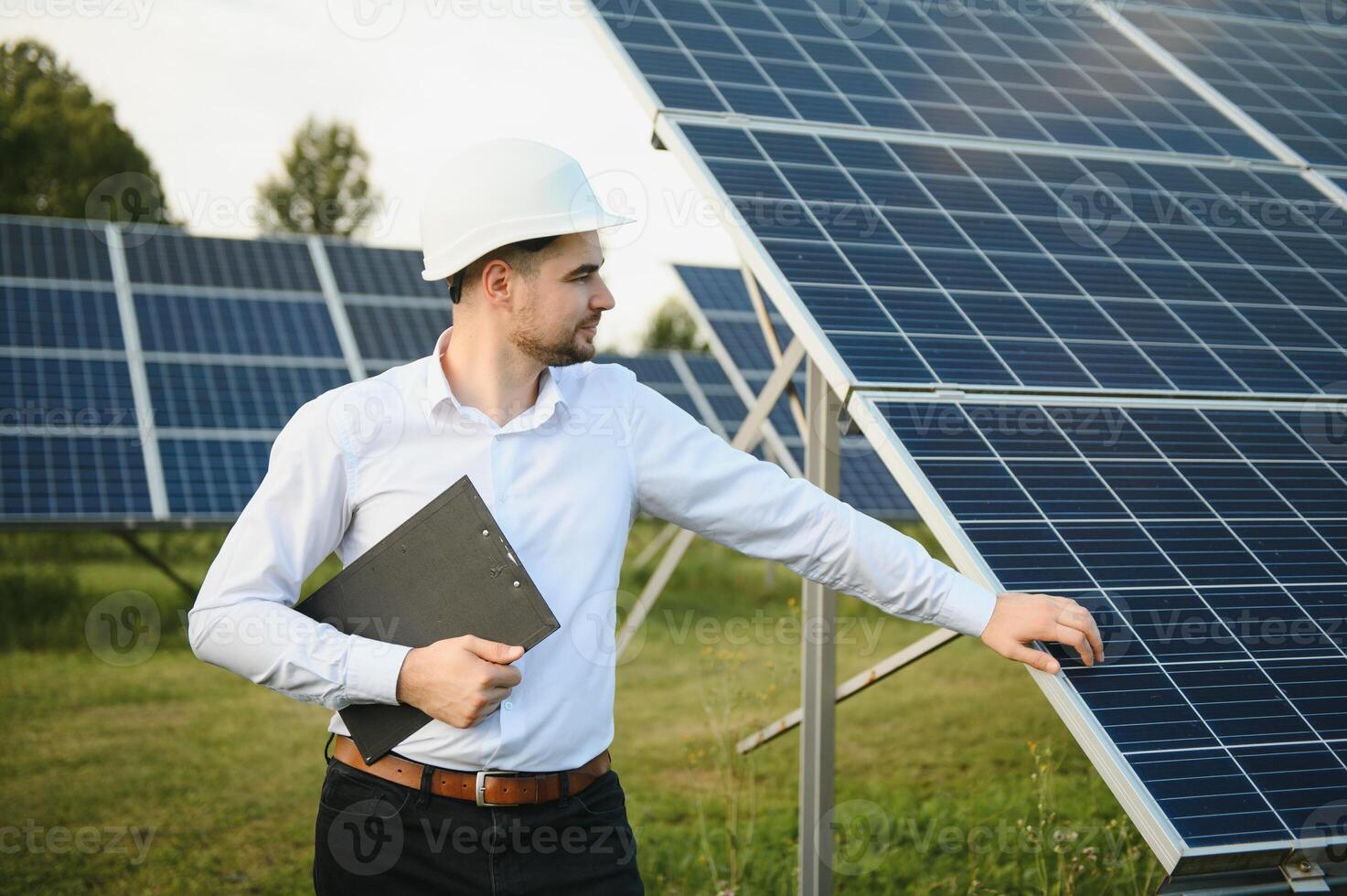 The solar farm, solar panel with engineer check the operation of the system, Alternative energy to conserve the worlds energy, Photovoltaic module idea for clean energy production. photo