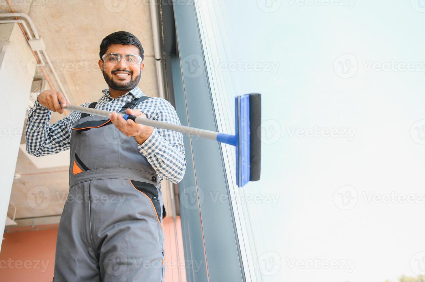 A man cleaning windows. men washes the windows photo