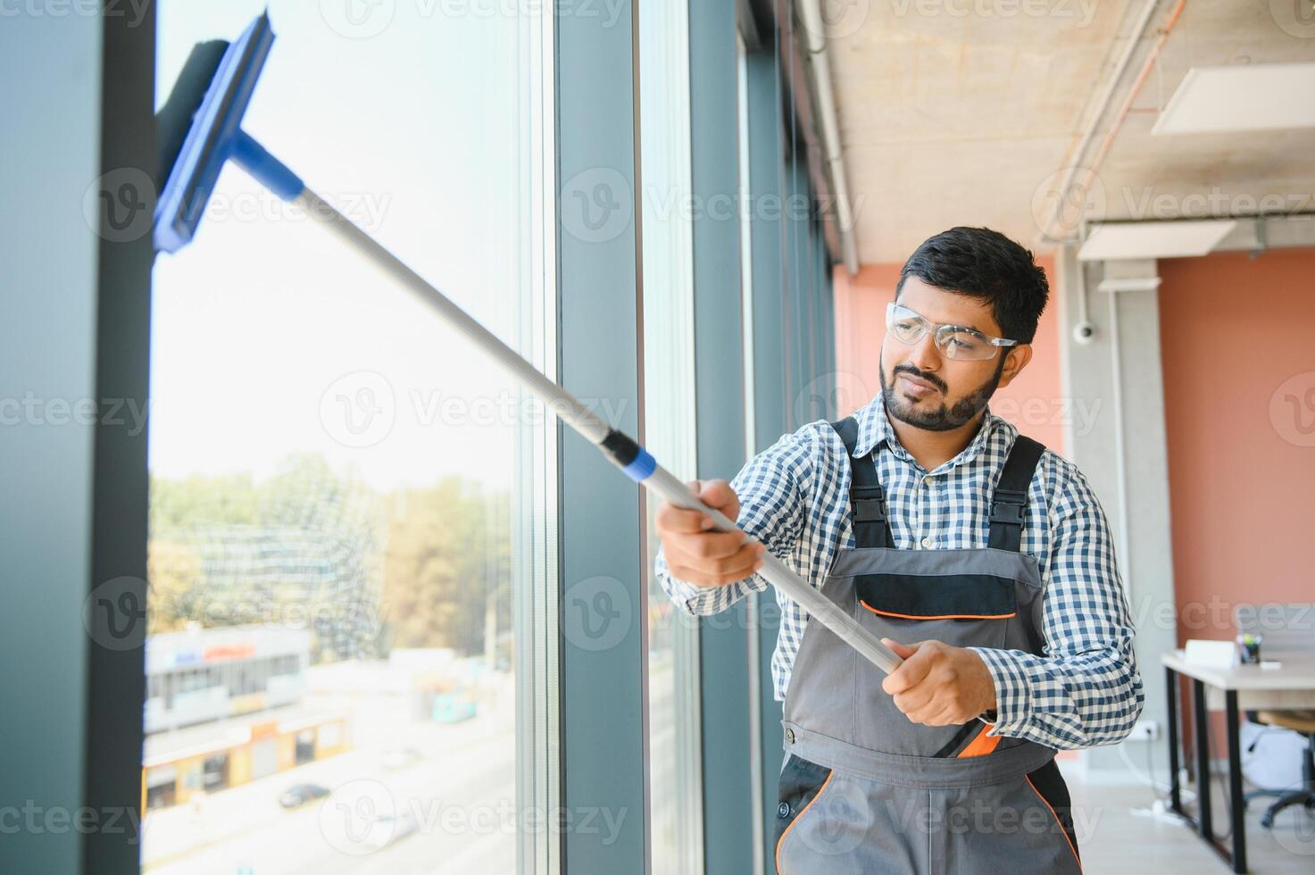 A man cleaning windows. men washes the windows photo