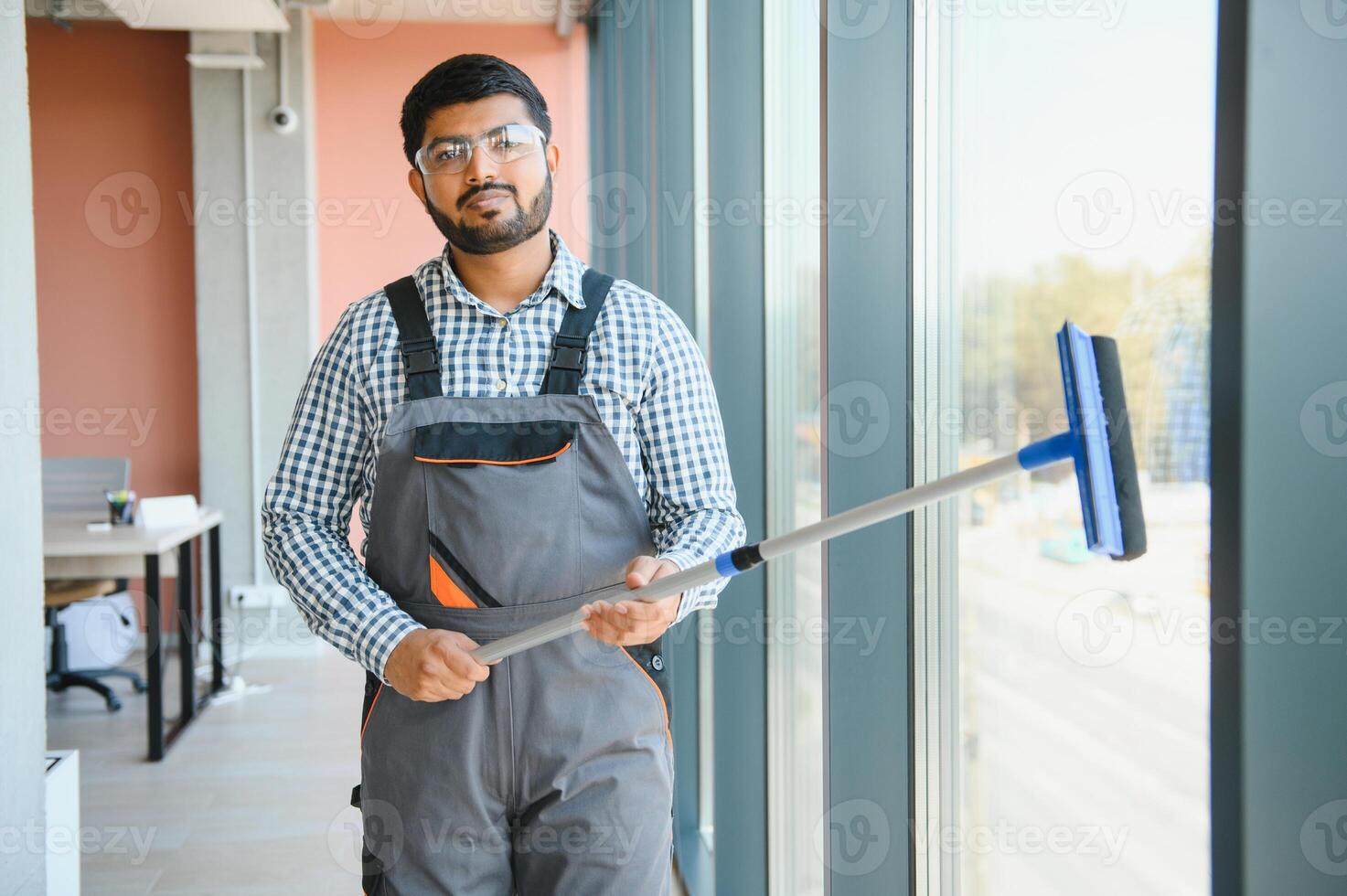 A man cleaning windows. men washes the windows photo