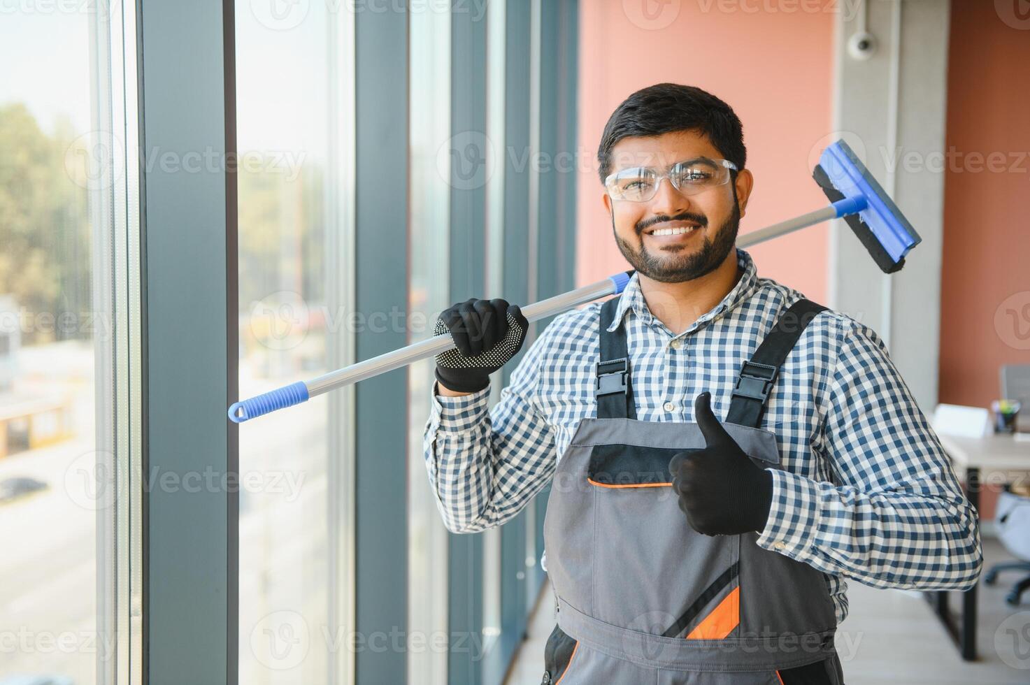 A man cleaning windows. men washes the windows photo