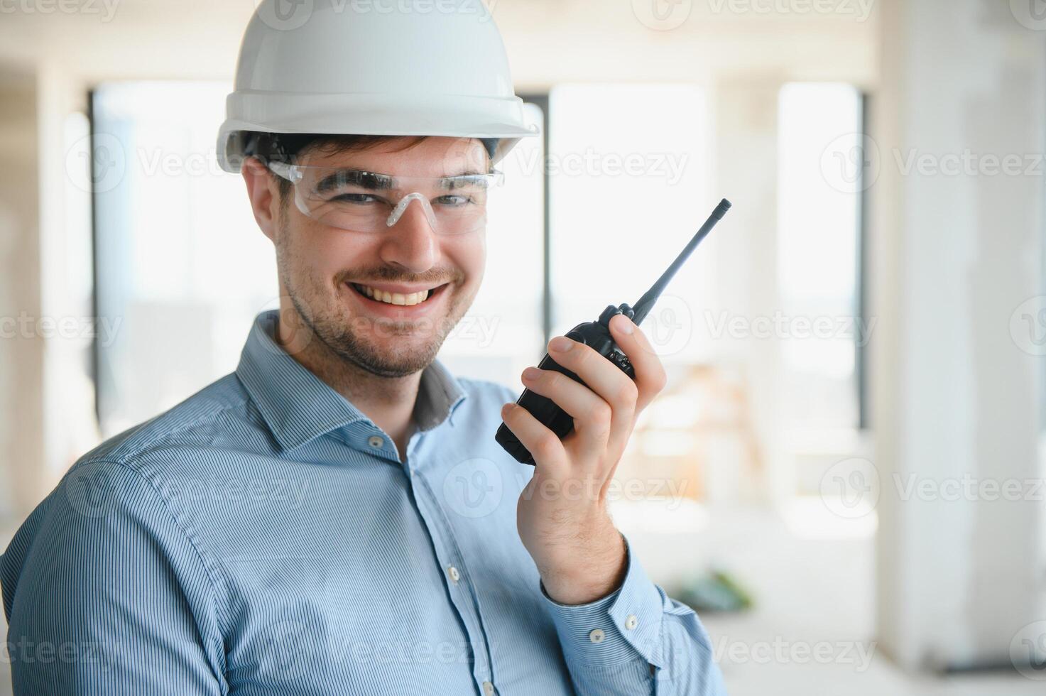 Man builder. Architect at construction site photo