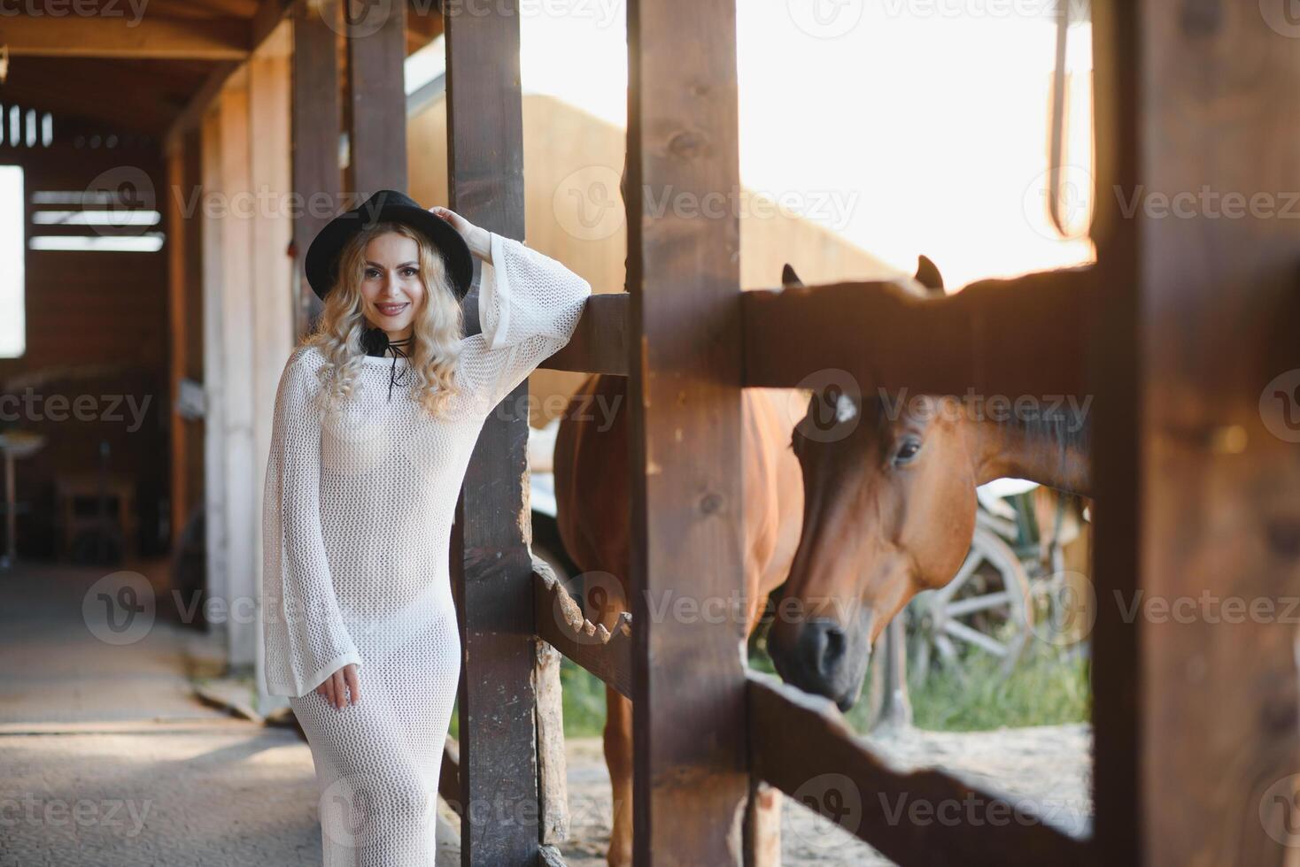 Portrait of beautiful blonde curl woman in dress, accessories with horse photo