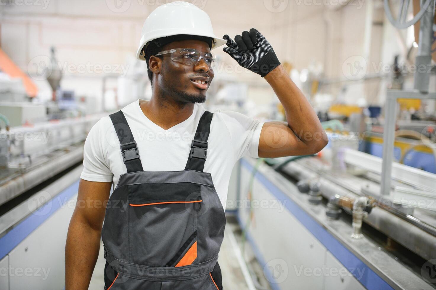 Factory for aluminum and PVC windows and doors production. Manual worker assembling PVC windows and doors photo