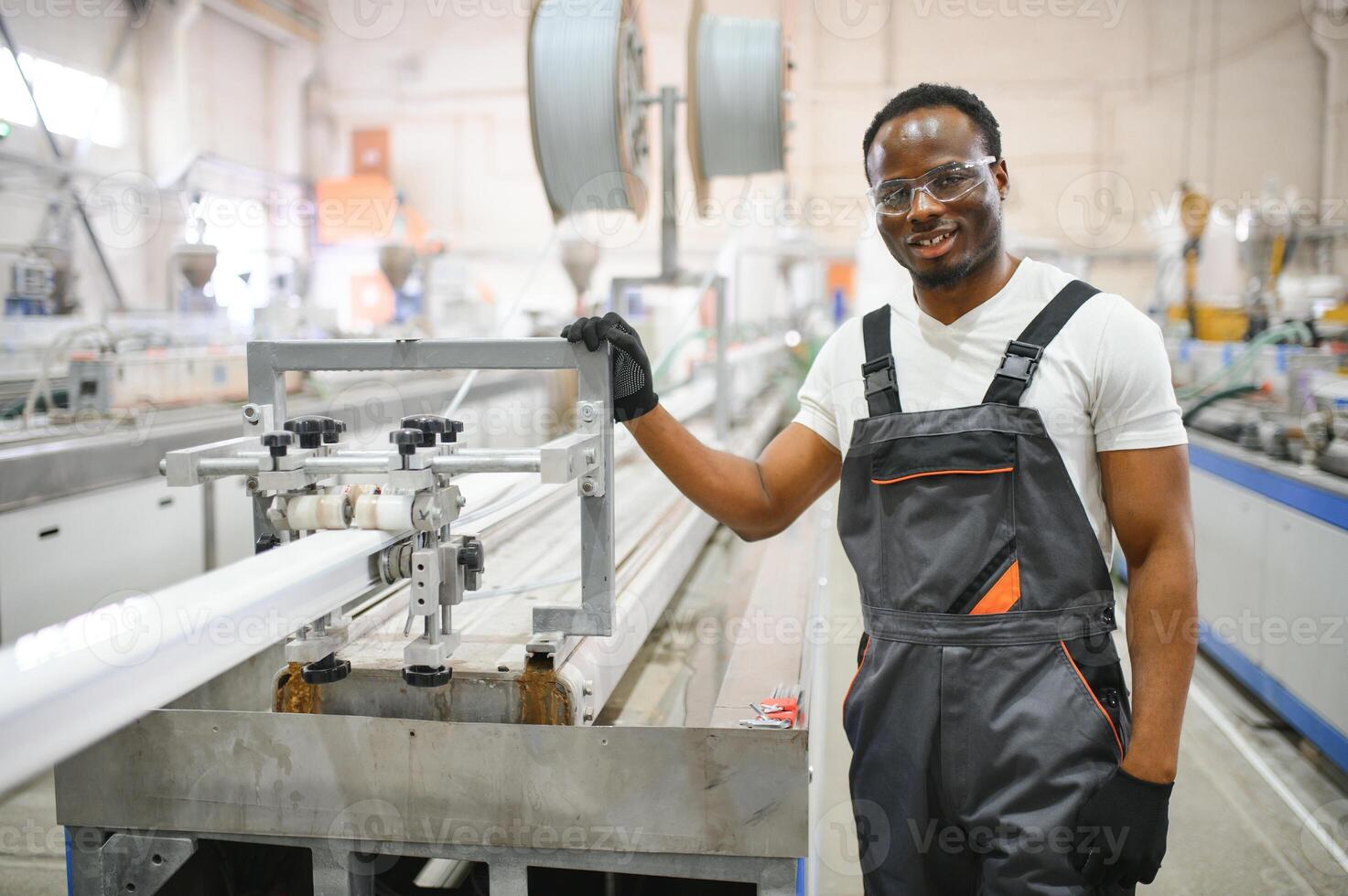Factory for aluminum and PVC windows and doors production. Manual worker assembling PVC windows and doors photo