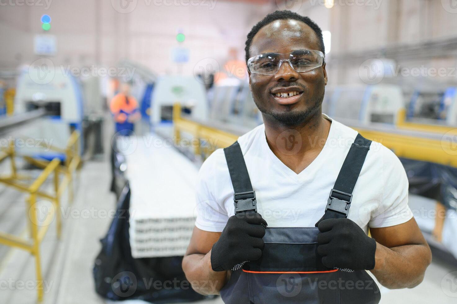 Factory for aluminum and PVC windows and doors production. Manual worker assembling PVC windows and doors photo