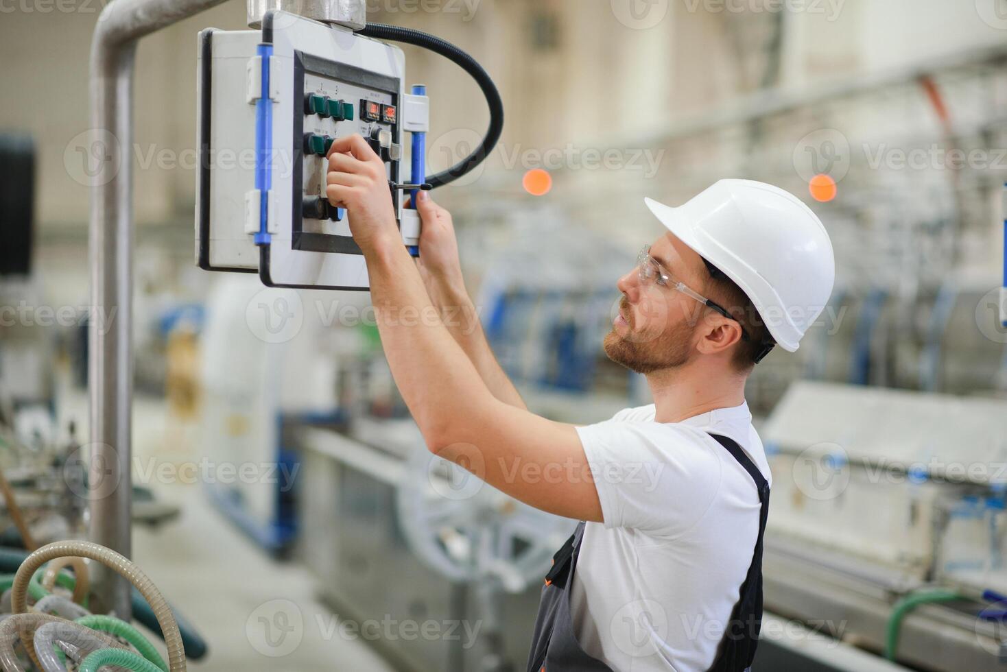 Factory worker. Man working on the production line photo