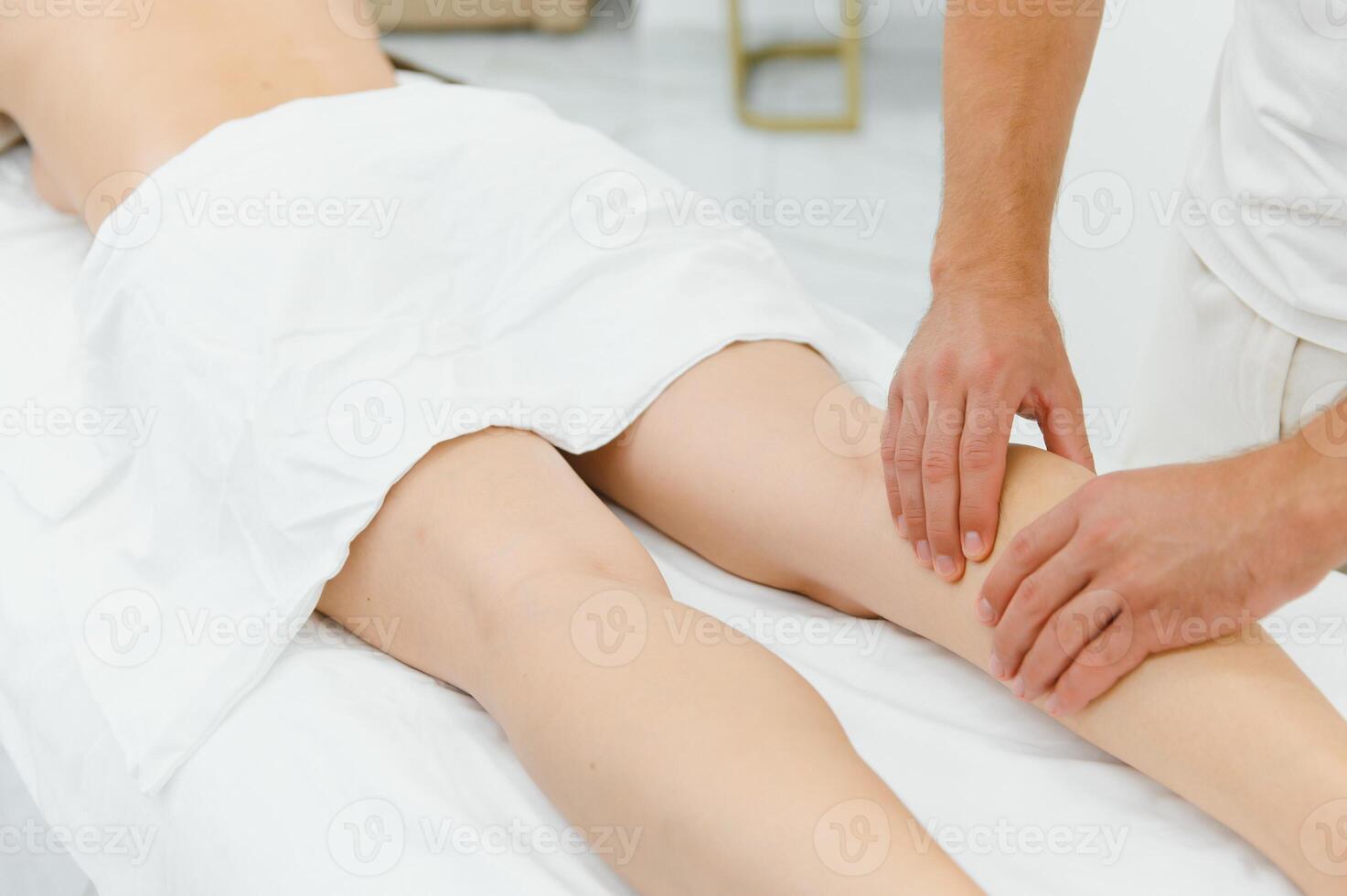 Woman getting relaxing feet massage with oils after long day photo