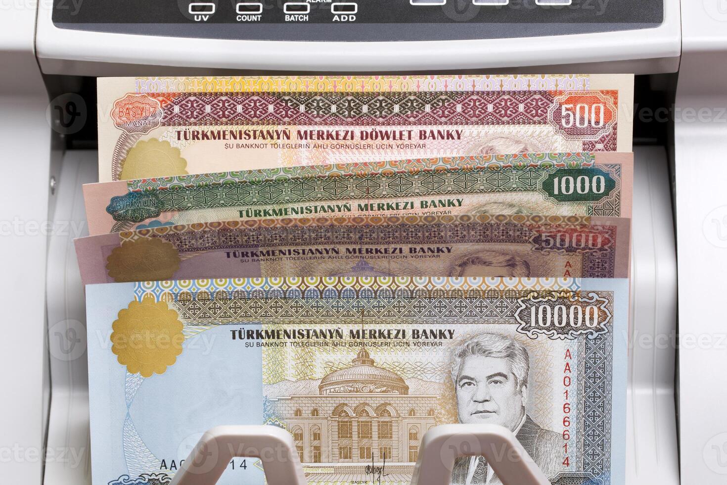 Turkmenistani manat in the counting machine photo