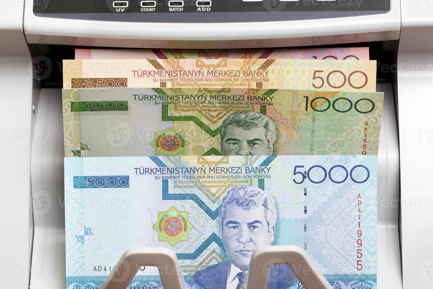 Turkmenistani manat in the counting machine photo