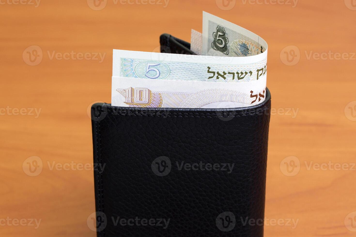 Israeli pound in the black wallet photo
