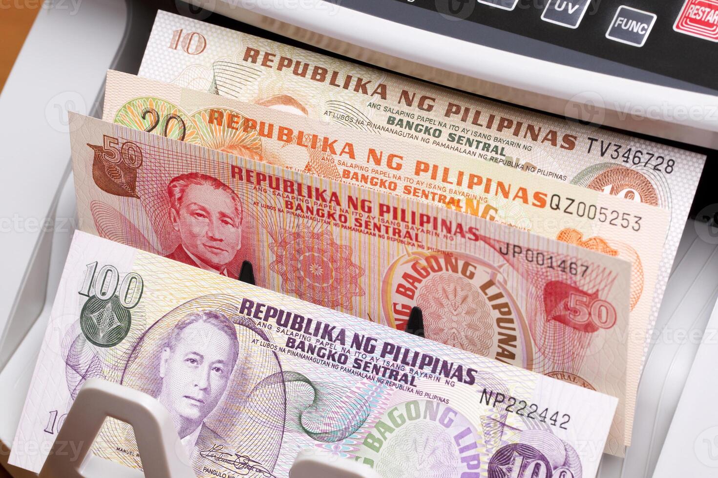Philippine peso in the counting machine photo