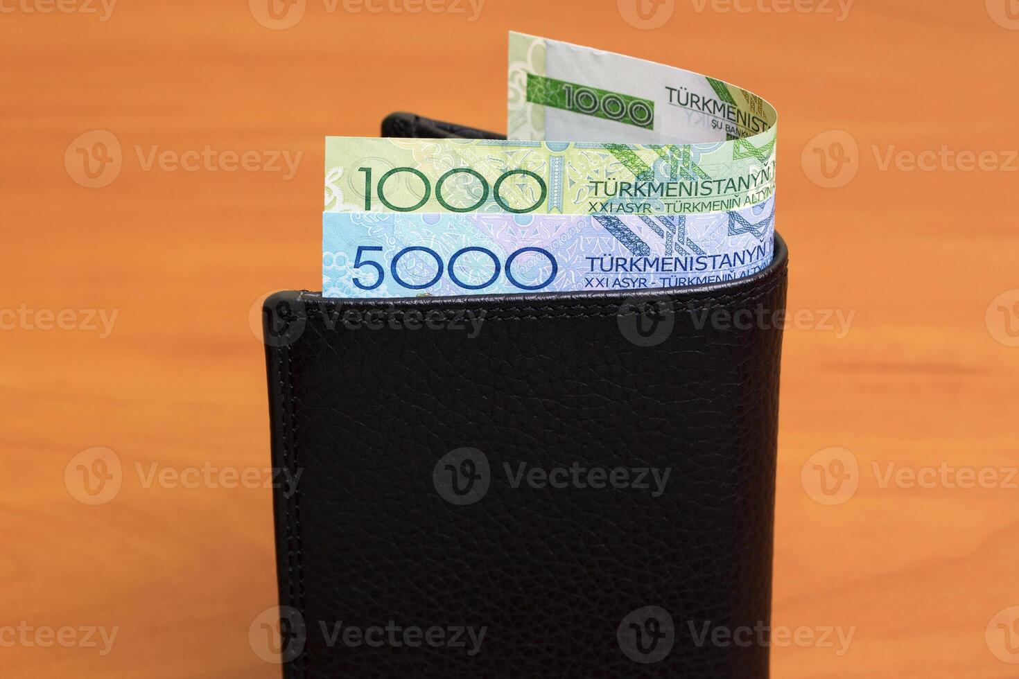 Old Turkmenistani manat in the black wallet photo