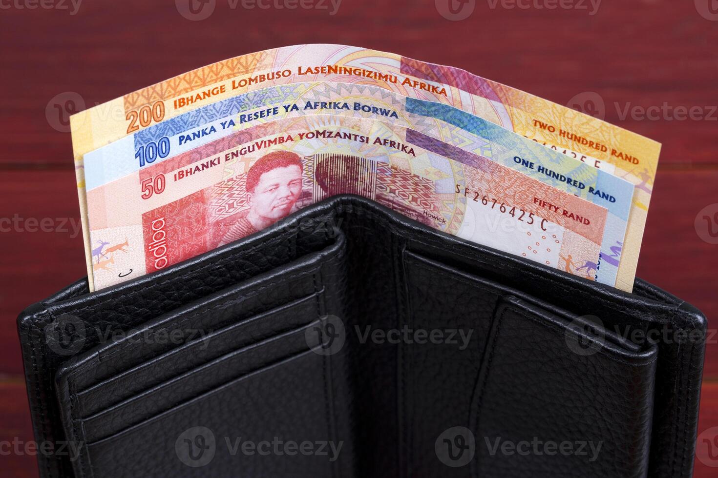 South African money in the black wallet photo