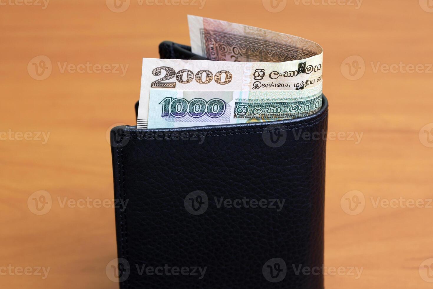 Sri Lankan rupee in the black wallet photo