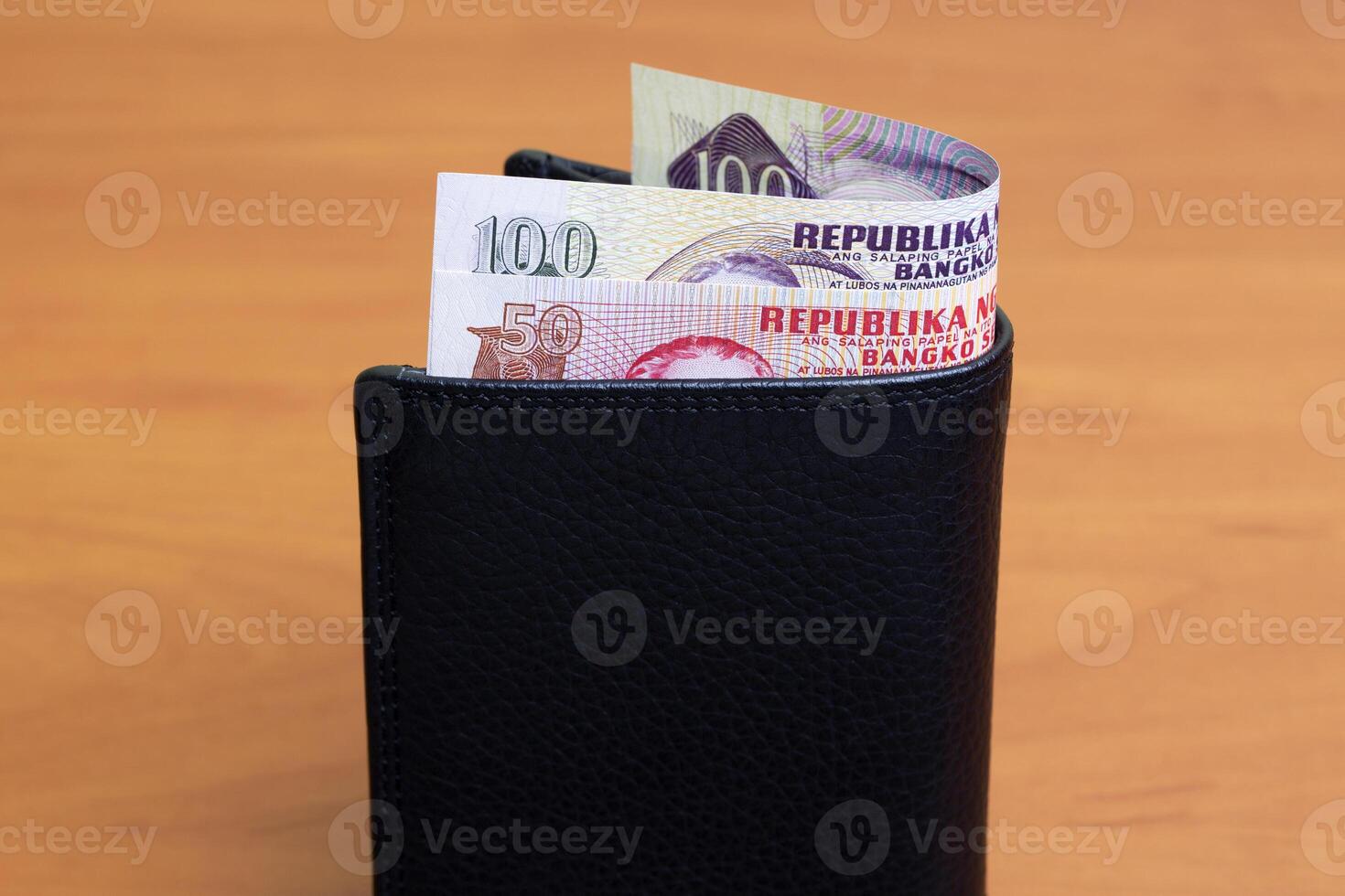 Philippine peso in the black wallet photo