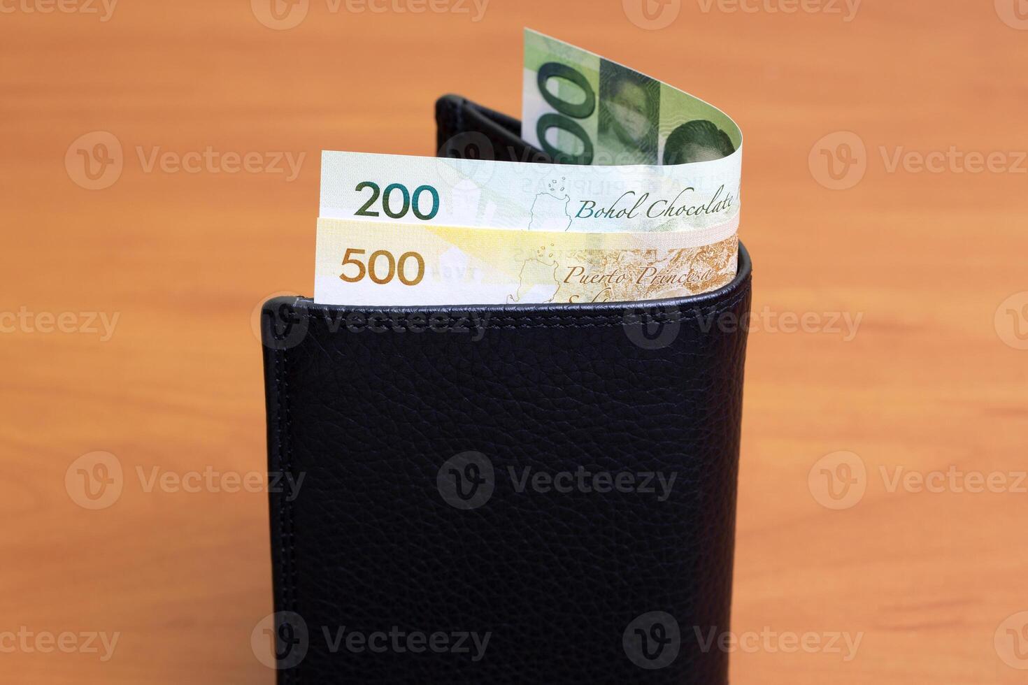 Philippine peso in the black wallet photo