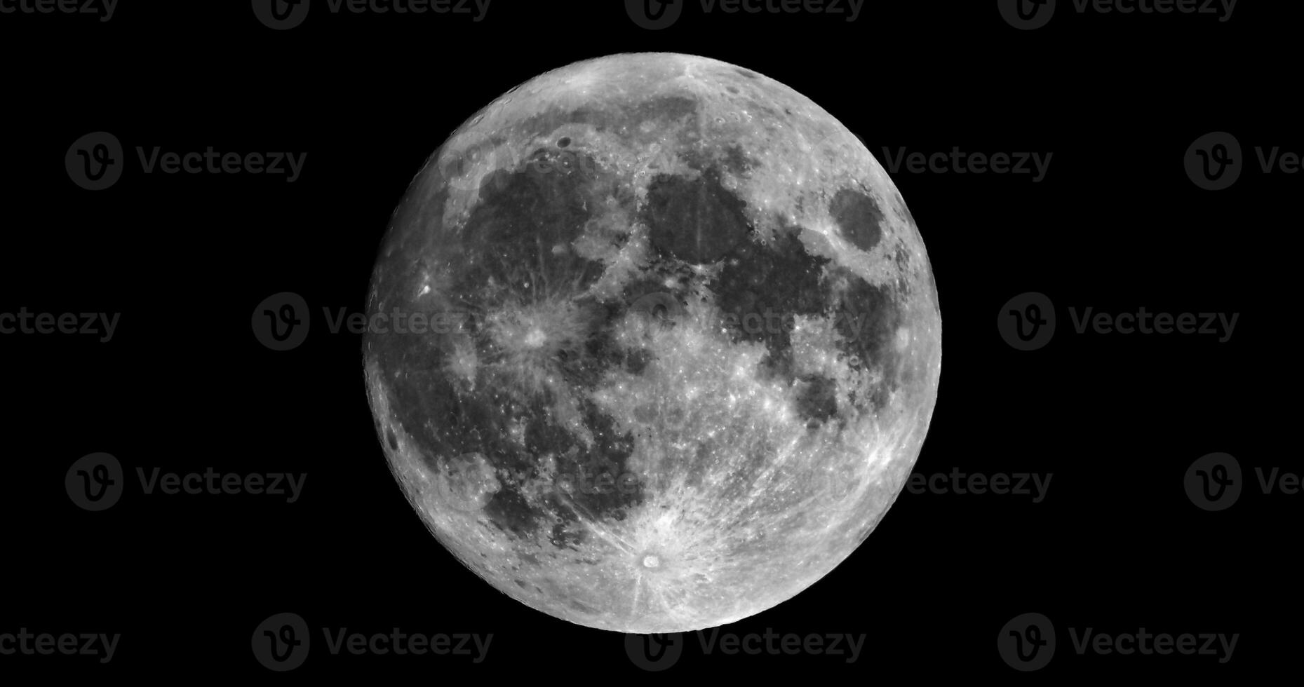 Full moon seen with telescope in black and white photo