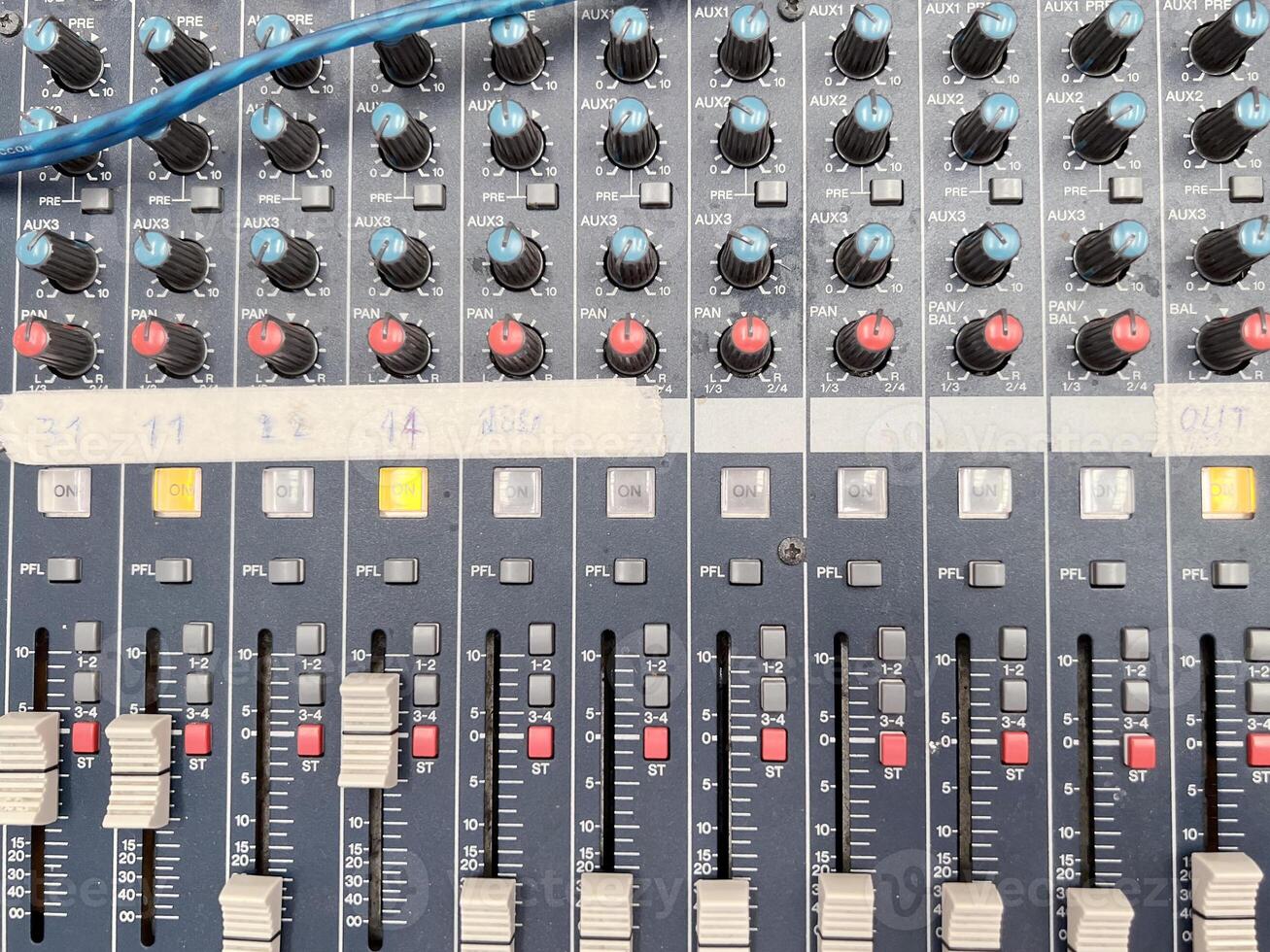 Top view of knobs with button of sound music mixer control panel. photo