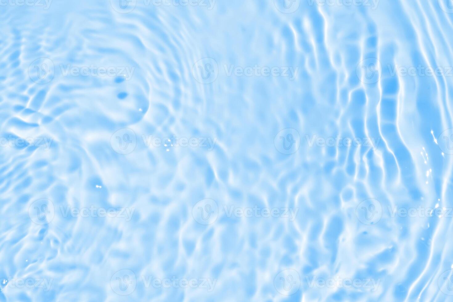 Abstract transparent water shadow surface texture natural ripple on blue background photo