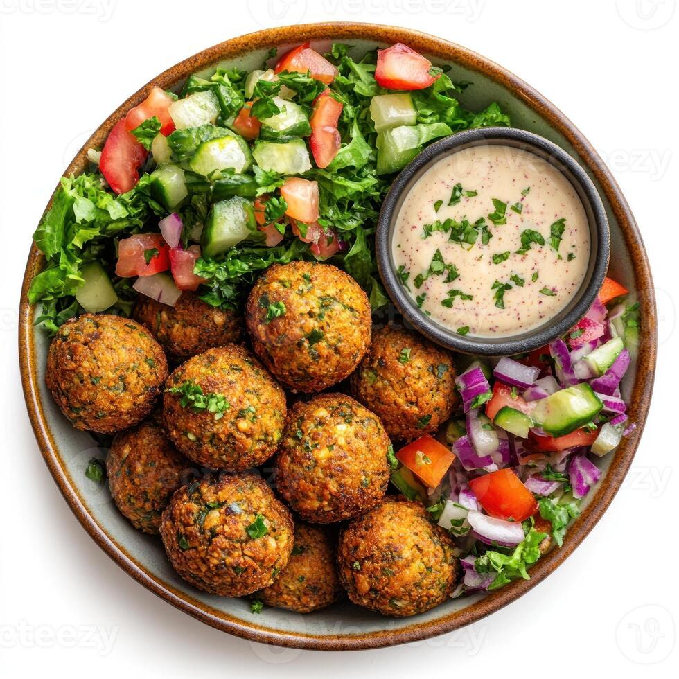 Falafel with Salad and Tahini Sauce in a Bowl photo