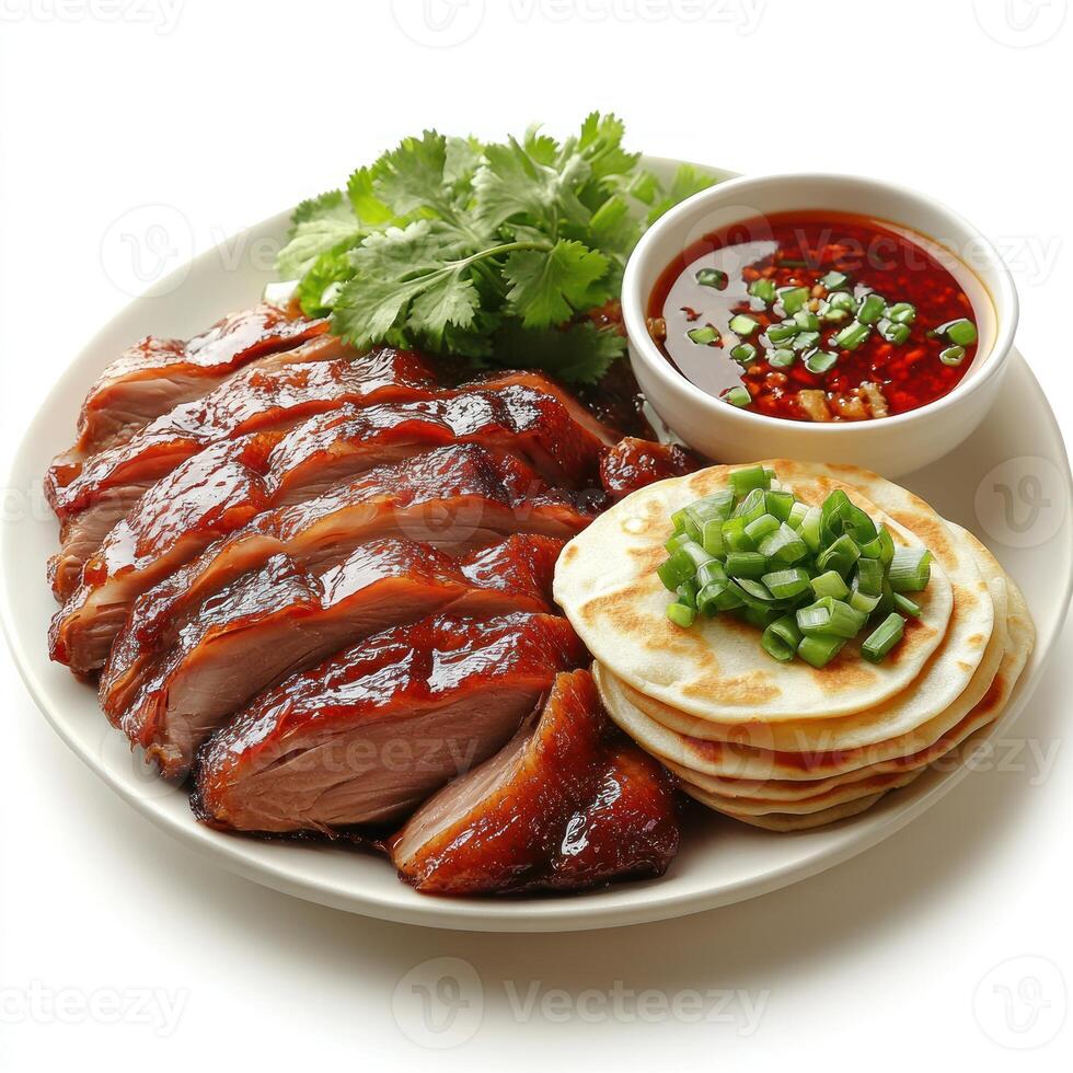 Roasted Duck with Pancakes, Sauce and Garnishes on a White Plate photo