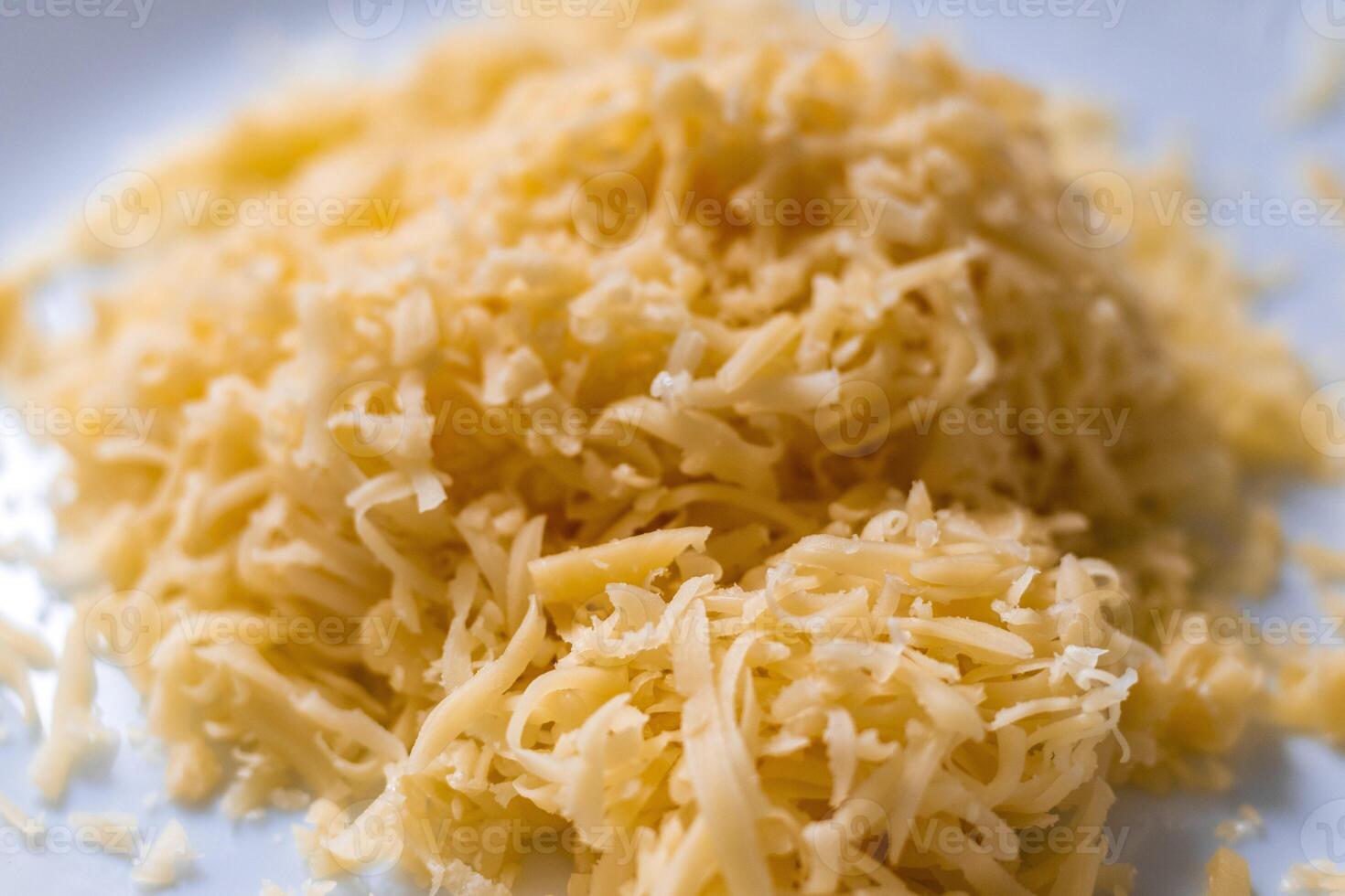 Close up shot of the grated cheese. Food photo
