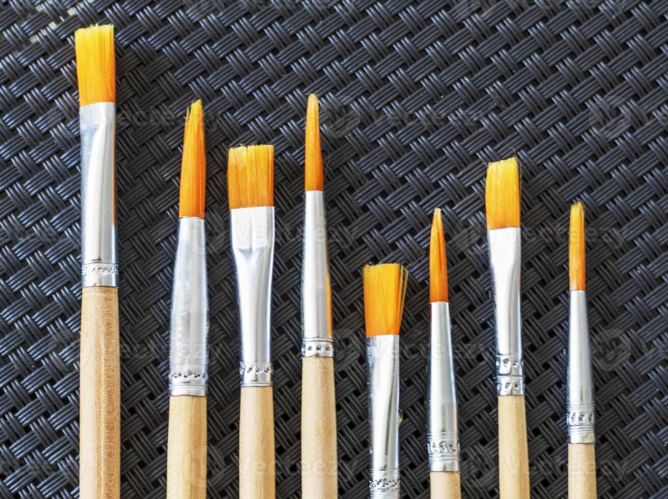 Shot of the different painting brushes with sizes marking on them. Art and craft photo