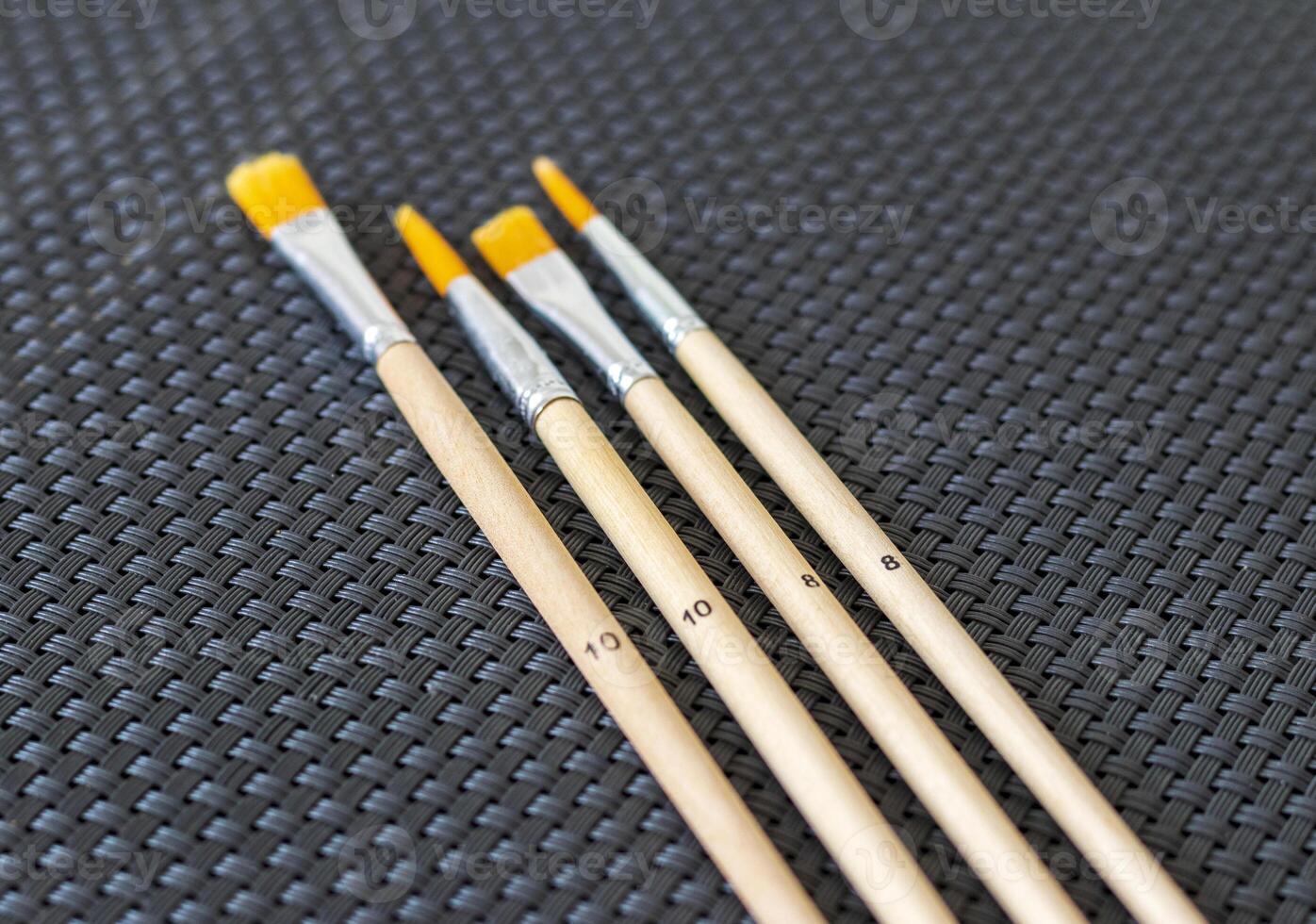 Shot of the different painting brushes with sizes marking on them. Art and craft photo