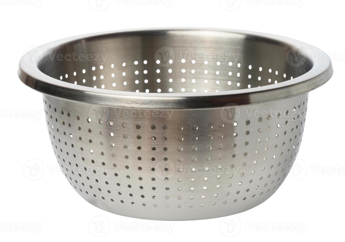 Round metal empty colander with holes on isolated background photo