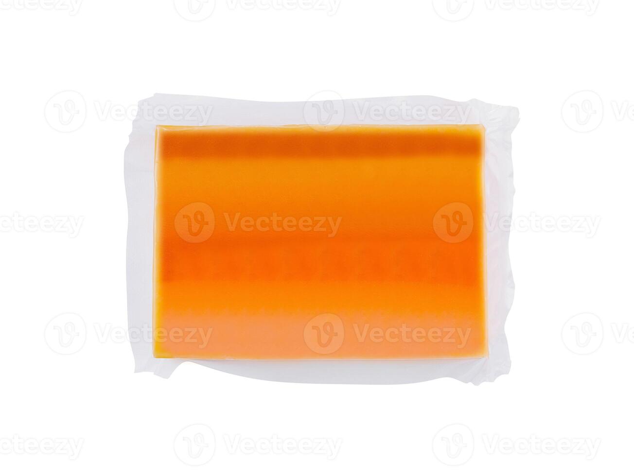 Vacuum packed block of cheddar cheese isolated on white background photo